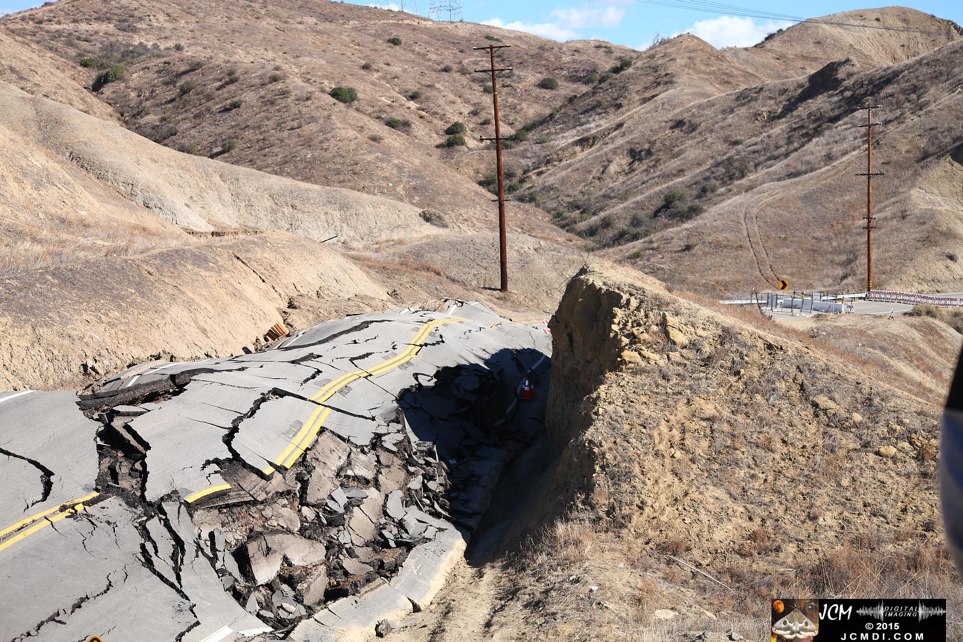 Landslide, buckled pavement, and terrain at Vasquez Canyon Road in Santa Clarita, CA filmed 11-25-2015